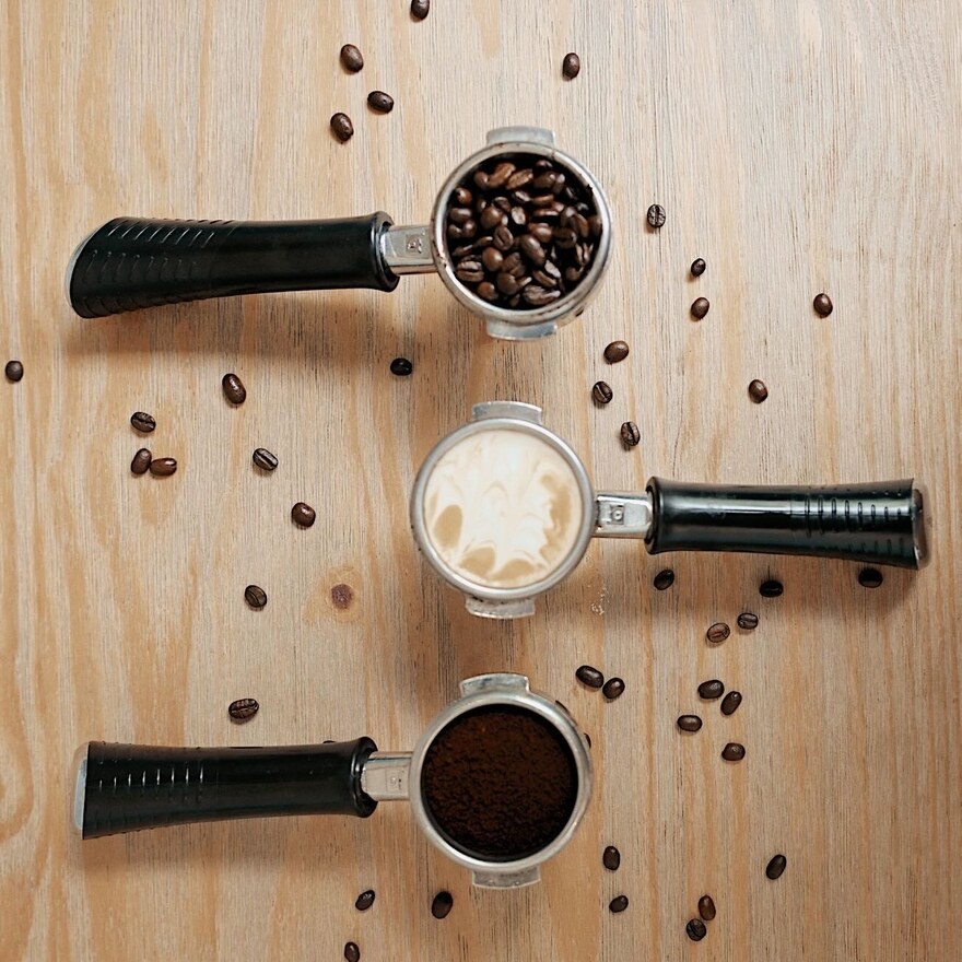 Espresso portafilters and fresh coffee beans